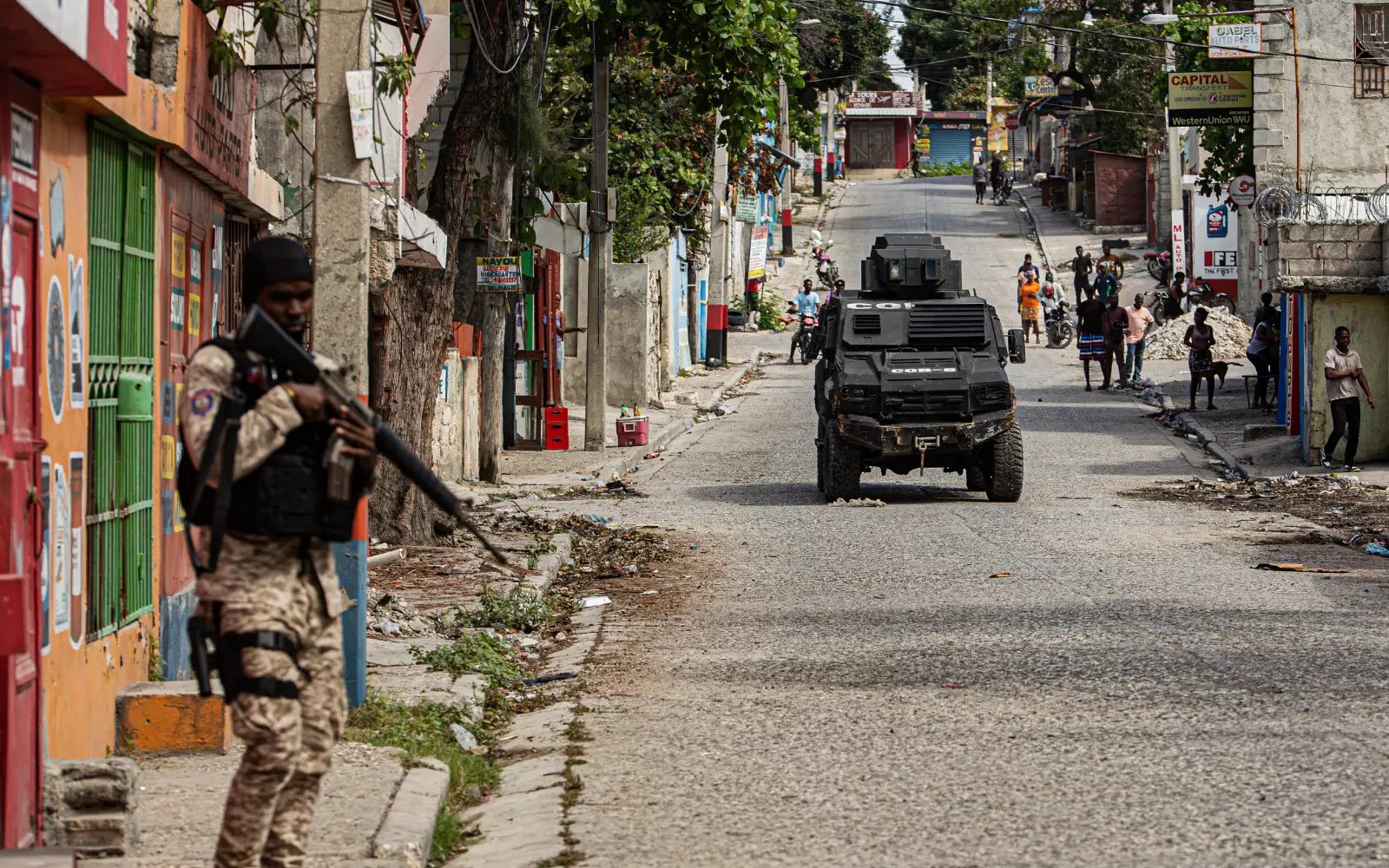7 arrested in Haiti as stampede toll revised to 25