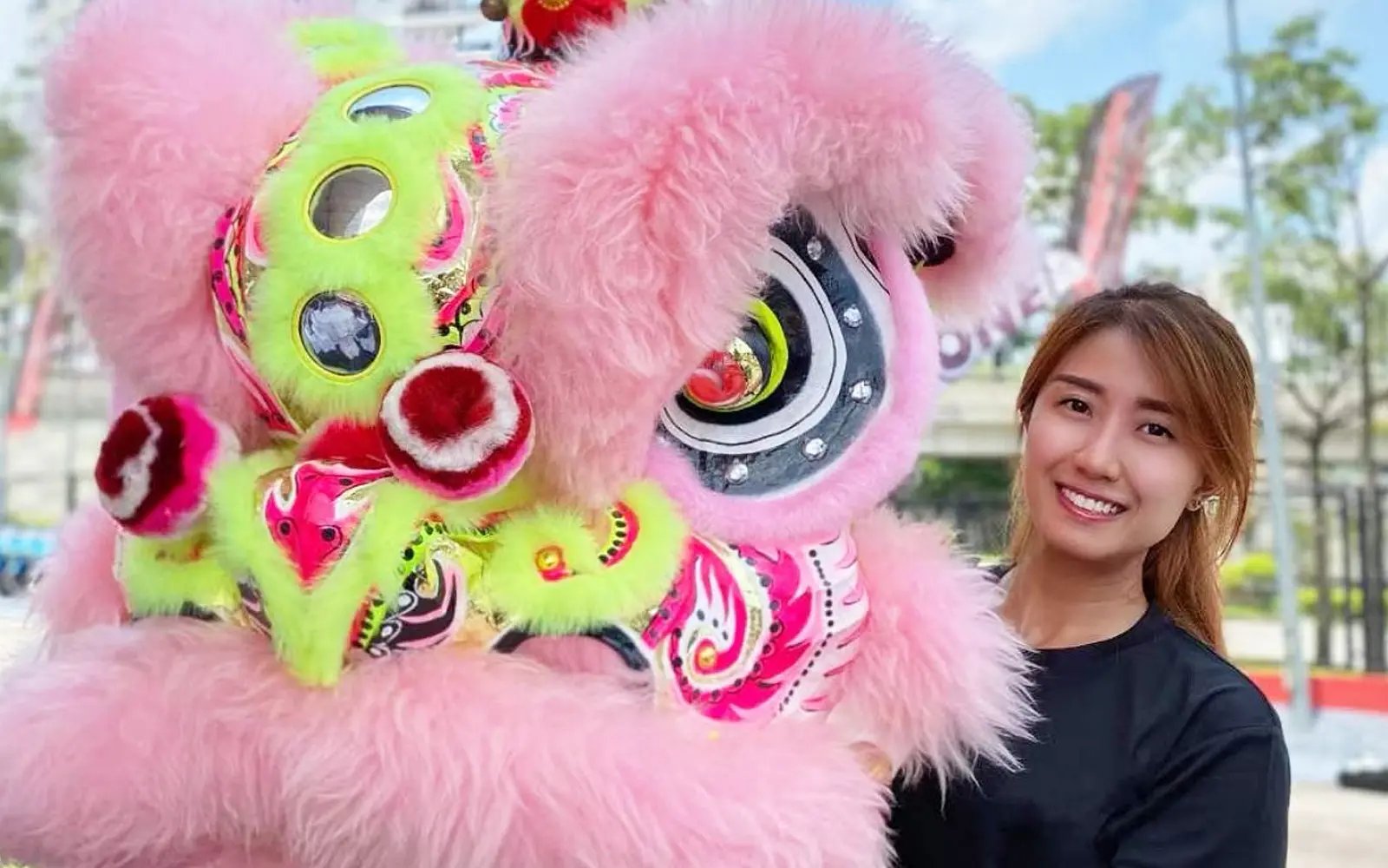 Female lion dance trainer moves against the grain