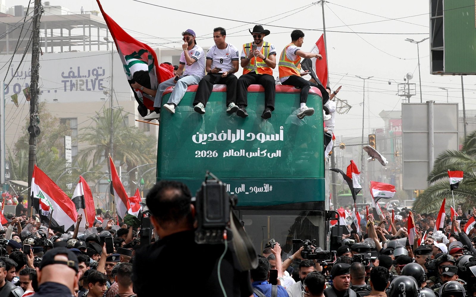 Thousands welcome Iraq’s football team home after World Cup qualifier