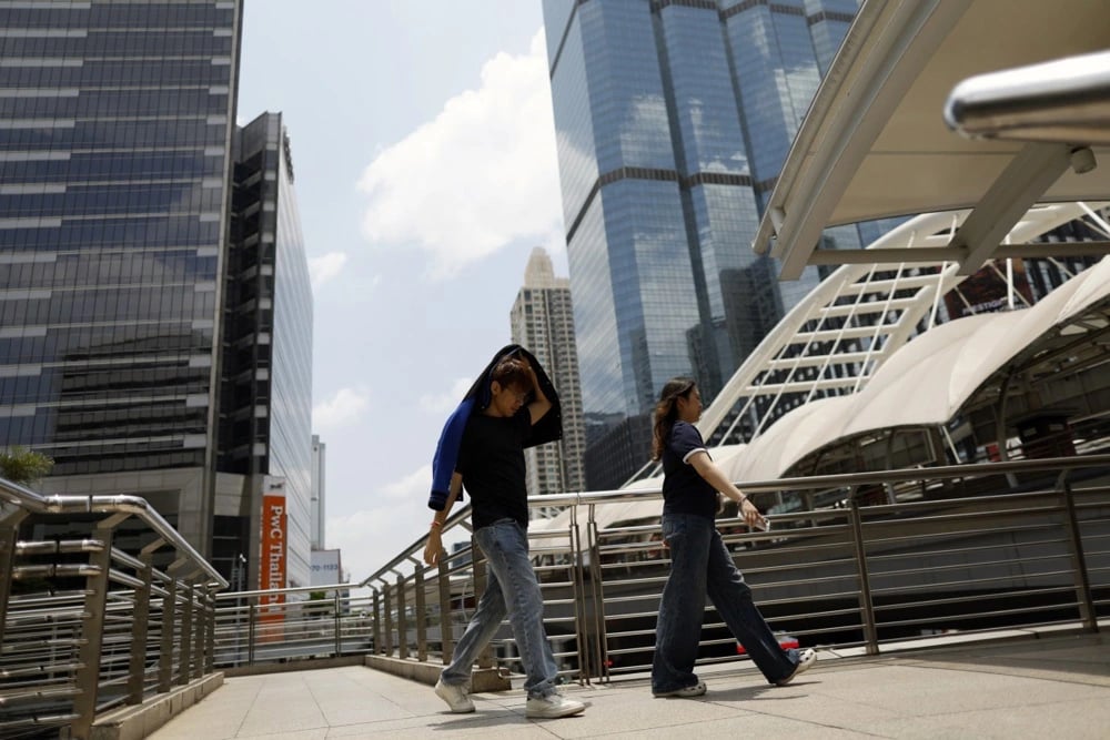Southeast Asia office workers swelter amid heat wave, energy-saving measures