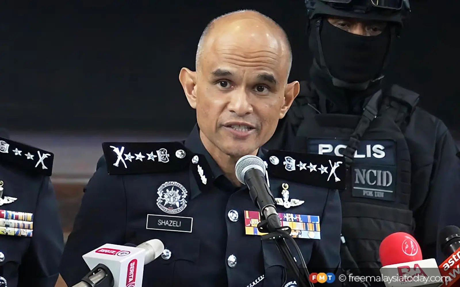 12 cops under probe for cryptocurrency heist given desk duty