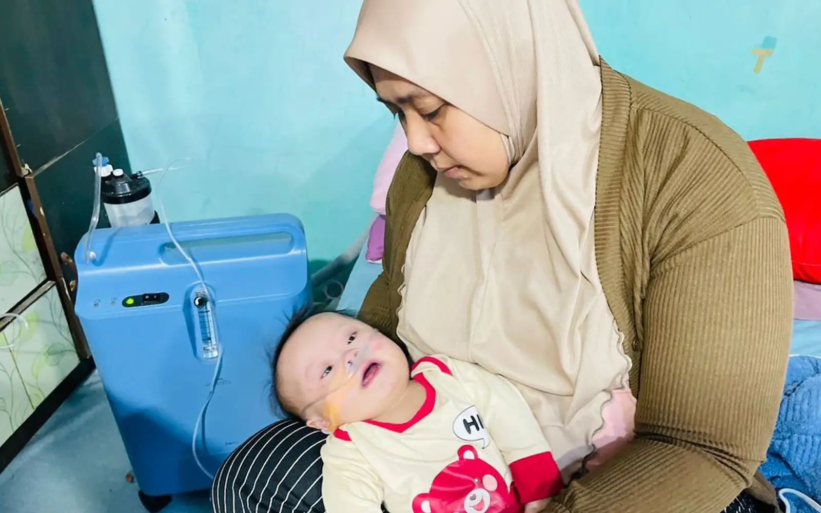 Every breath counts for baby Awang as his parents race against time
