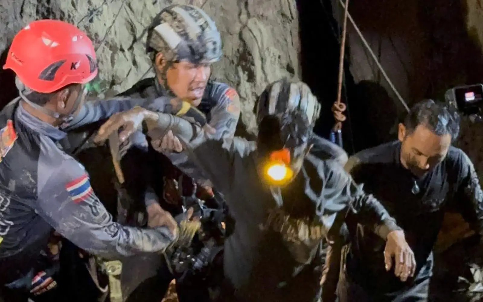 Rescuers free 1 of 7 men trapped in Laos cave